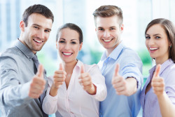 Business team with thumbs up